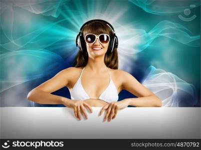 Summer disco party. Attractive girl in bikini with white blank banner