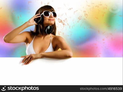 Summer disco party. Attractive girl in bikini with white blank banner