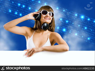 Summer disco party. Attractive girl in bikini with white blank banner