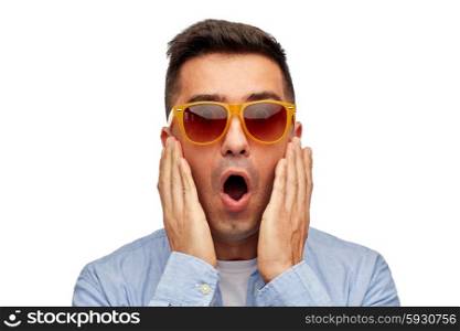 summer, emotions, style and people concept - face of scared or surprised middle aged latin man in shirt and sunglasses