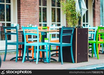 Summer empty open air cafe in european city. Summer empty open air restaraunt in Europe.