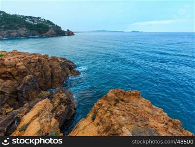 Summer evening sea rocky coast view with house on shore. Costa Brava, Catalonia, Spain.