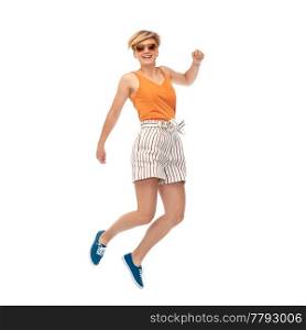 summer, fashion and people concept - happy teenage girl in sunglasses jumping over white background. happy teenage girl in sunglasses jumping