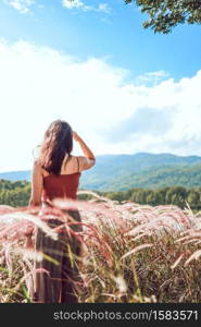 Summer Flowers Beautiful young asian woman fabulous nature waiting for summer sun on meadow vacation Asian girl Happy girl relaxing enjoys the autumn sunset