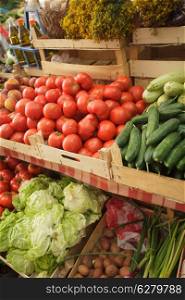 Summer fresh vegetables in boxes on the market