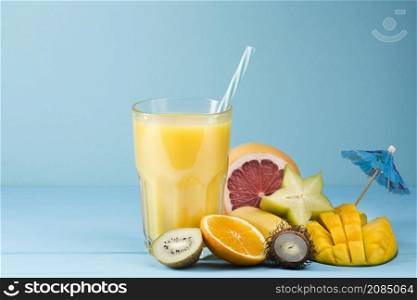 summer fruit juice blue background