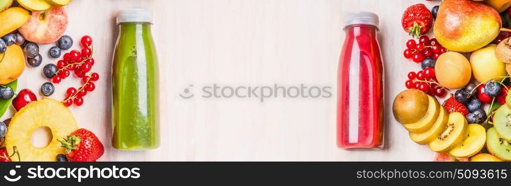 Summer fruits and berries beverages . Red and green smoothies and juices in bottles with ingredients on white table background, top view, frame, banner