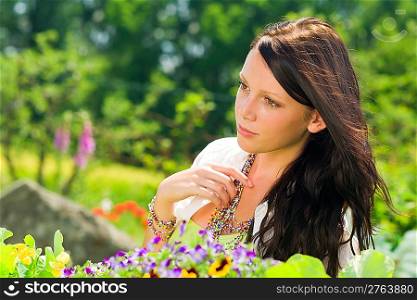Summer garden colorful flowers beautiful young woman dreamy look