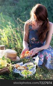 Summer - girl on a picnic in a meadow in the forest