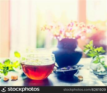 Summer herbal tea with fresh herbs on window sill. Healthy ,healing or detox drinks concept