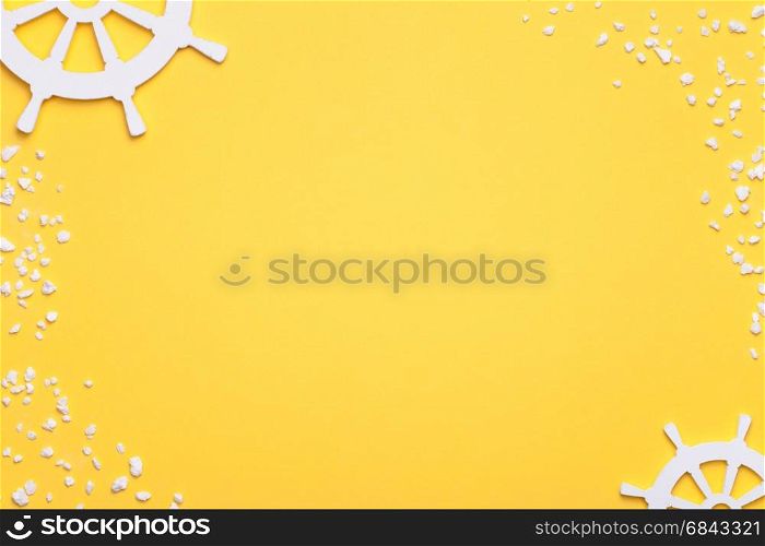 Summer holiday vacation background with rudders and sand in white. Copy space. Top view