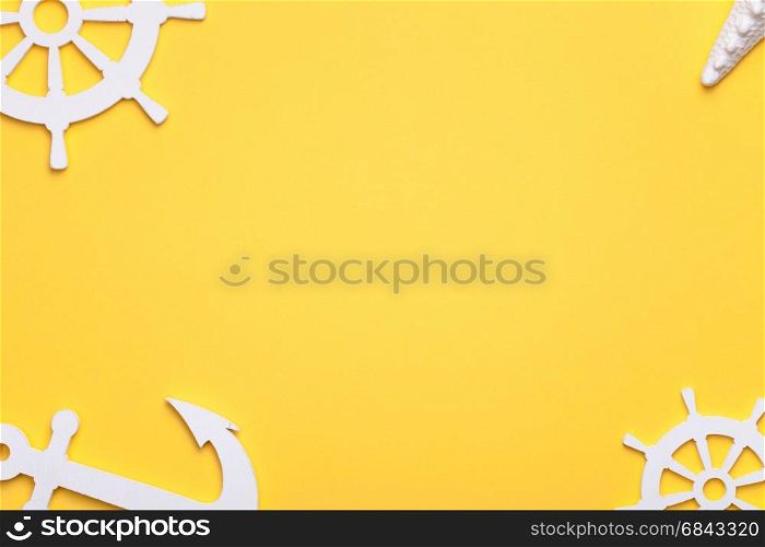 Summer holiday vacation background with starfish, anchor and rudders in white. Copy space. Top view