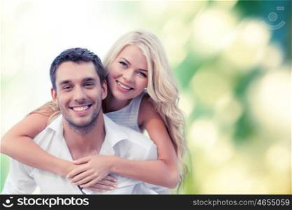 summer holiday, vacation, dating and love concept - happy couple having fun over green background