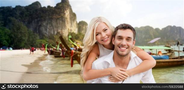 summer holiday, vacation, dating and tourism concept - happy couple having fun over beach in thailand or bali background