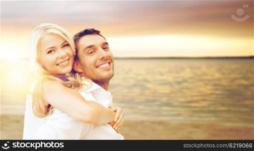 summer holiday, vacation, dating and tourism concept - happy couple having fun on the beach
