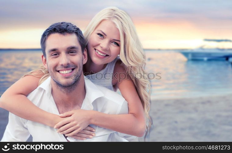 summer holiday, vacation, dating and travel concept - happy couple having fun over tropical beach background