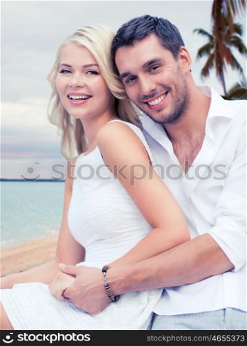 summer holiday, vacation, dating, travel and tourism concept - happy couple having fun and hugging over beach background