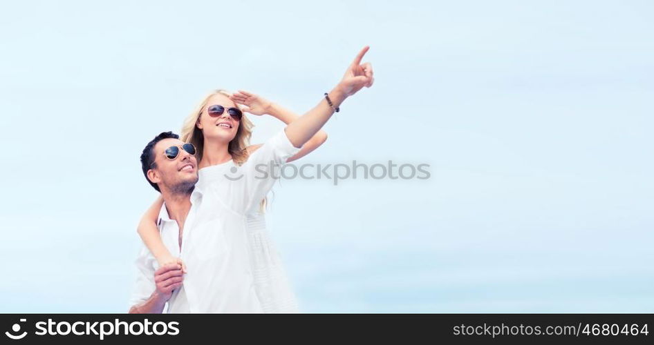 summer holidays and dating concept - couple in shades at sea side. couple in shades at sea side