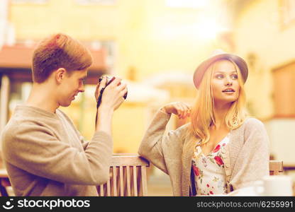 summer holidays and dating concept - couple taking photo picture at cafe in the city. couple taking photo picture in cafe