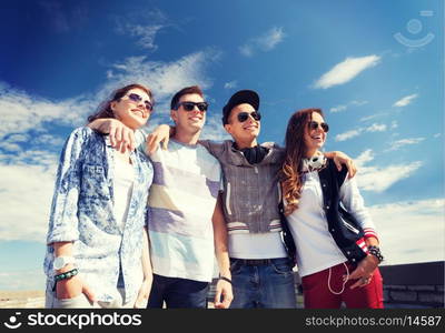 summer holidays and teenage concept - group of teenagers outside