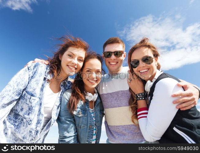 summer holidays and teenage concept - group of teenagers outside. group of teenagers outside