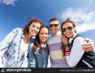 summer holidays and teenage concept - group of teenagers outside. group of teenagers outside
