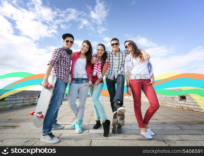 summer holidays and teenage concept - group of teenagers with skates outside