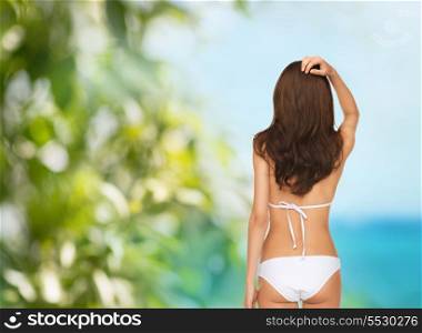 summer holidays and vacation concept - beautiful woman posing in white bikini
