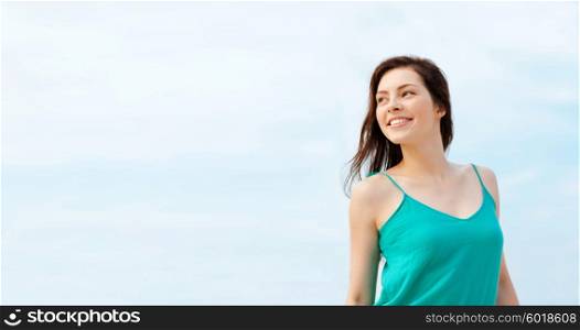 summer holidays and vacation concept - girl standing on the beach. girl standing on the beach