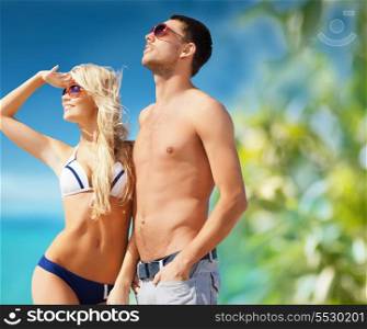 summer holidays and vacation concept - happy couple on the beach