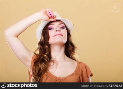 Summer holidays and vacation. Girl in fashionable clothes straw hat. Portrait of attractive woman tourist on bright background