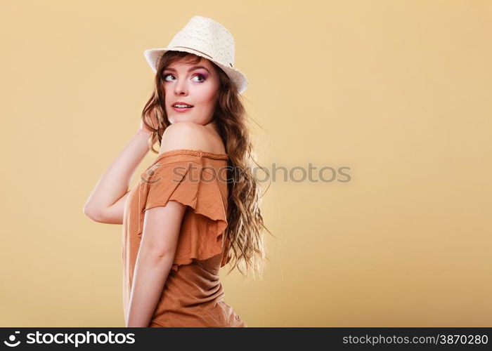 Summer holidays and vacation. Girl in fashionable clothes straw hat. Portrait of charming woman studio shot