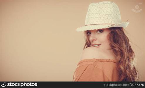 Summer holidays and vacation. Girl in fashionable clothes straw hat. Portrait of charming woman studio shot