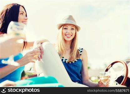 summer holidays and vacation - girl with champagne glass on boat or yacht