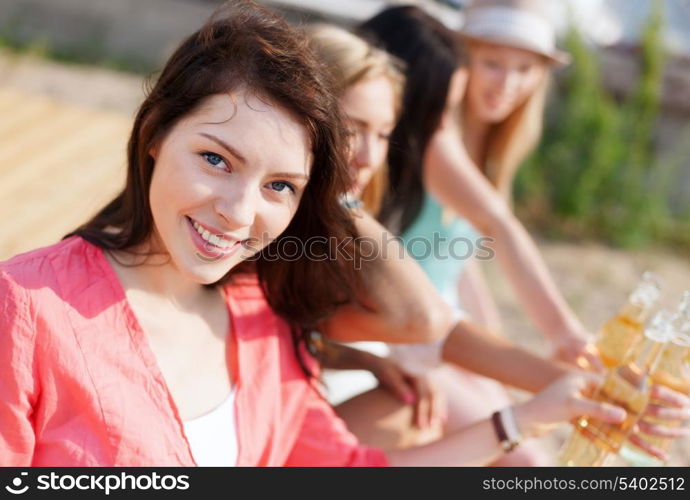 summer holidays and vacation - girl with drink on the beach