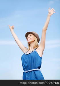 summer holidays and vacation - girl with hands up on the beach. girl with hands up on the beach