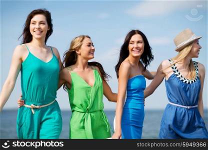 summer holidays and vacation - girls walking on the beach. girls walking on the beach