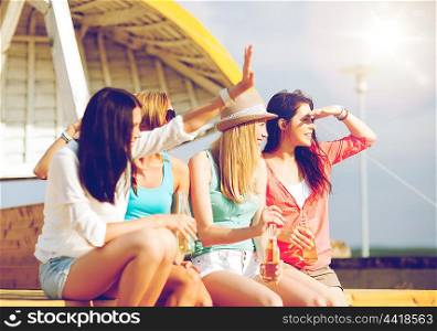 summer holidays and vacation - girls with drinks on the beach. girls with drinks on the beach