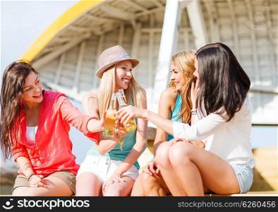 summer holidays and vacation - girls with drinks on the beach. girls with drinks on the beach