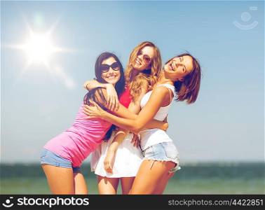 summer holidays and vacation - group of girls having fun on the beach. group of girls chilling on the beach