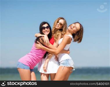 summer holidays and vacation - group of girls having fun on the beach