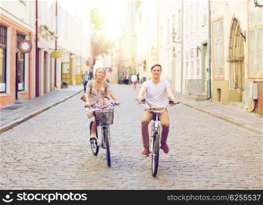 summer holidays, bikes, love, relationship and dating concept - couple with bicycles in the city