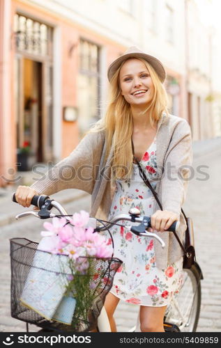 summer holidays, bikes, travel concept - attractive woman in hat with bicycle in the city