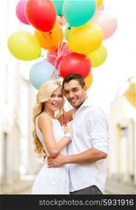 summer holidays, celebration and dating concept - couple with colorful balloons in the city