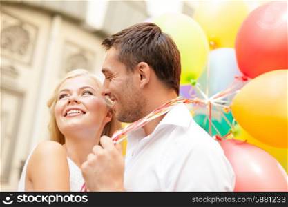 summer holidays, celebration and dating concept - happy couple with colorful balloons in the city