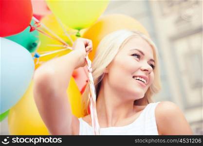 summer holidays, celebration and lifestyle concept - beautiful woman with colorful balloons in the city