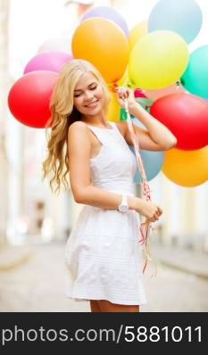 summer holidays, celebration and lifestyle concept - beautiful woman with colorful balloons in the city