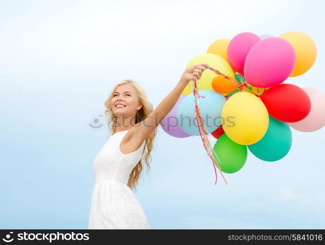 summer holidays, celebration and lifestyle concept - beautiful woman with colorful balloons outside