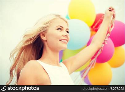 summer holidays, celebration and lifestyle concept - beautiful woman with colorful balloons outside