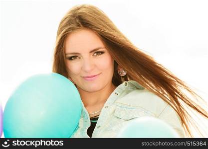 Summer holidays, celebration and lifestyle concept - Closeup beautiful woman face teen girl with colorful balloons outside